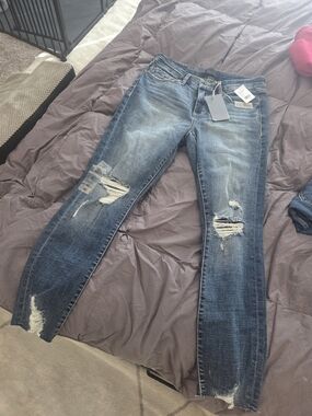 Distressed Women's Blue Denim Jeans